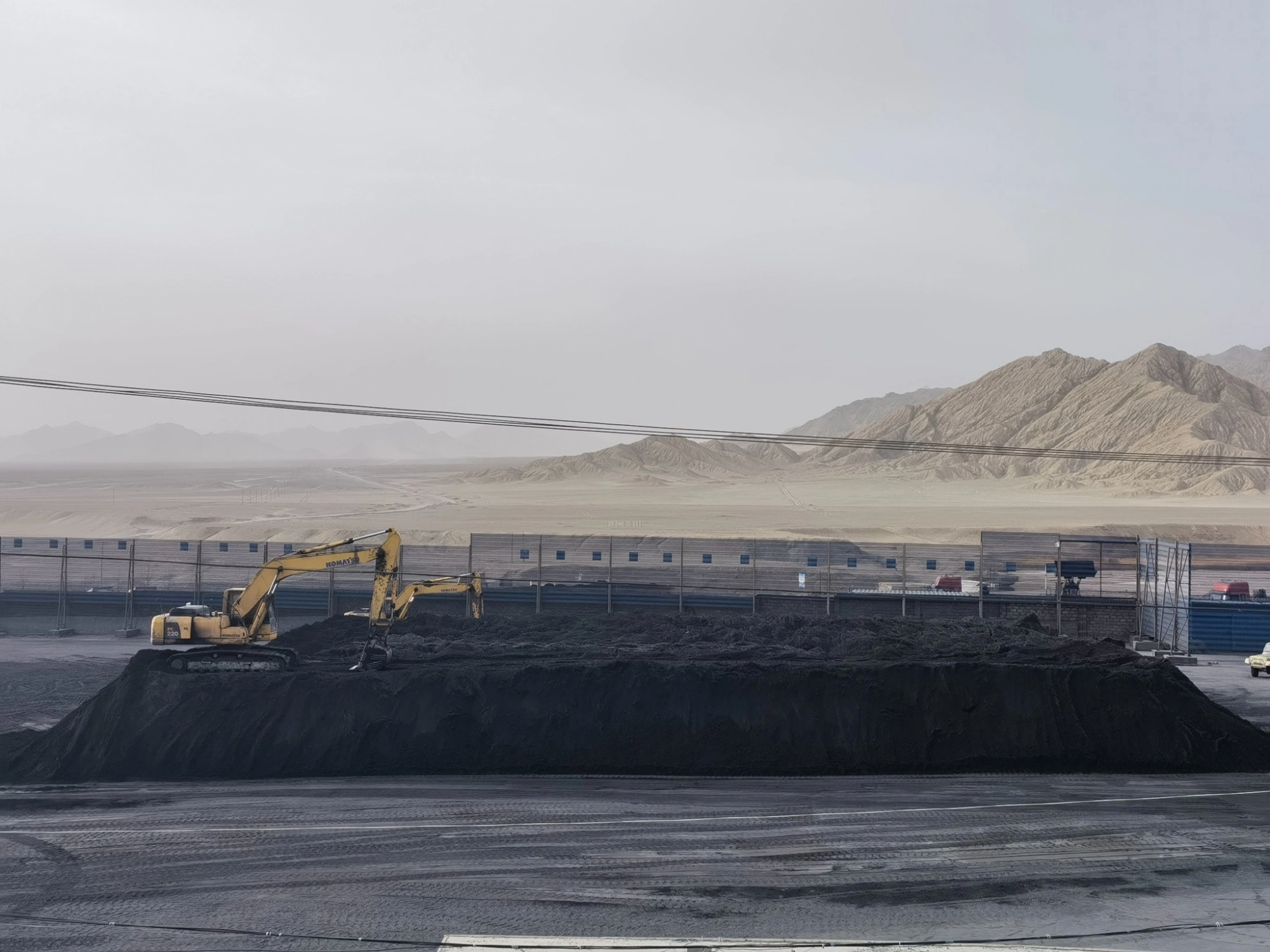Open-pit mining site with an excavator